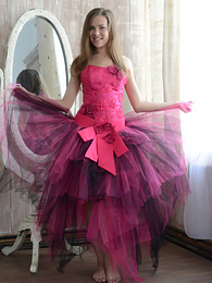 KiloTeens presents: Gorgeous teen cutie stripping an evening dress and showing body in front of a big mirror.