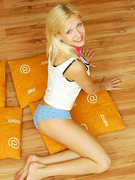 KiloTeens presents: Amazing blonde nude teen decided to place herself at the attic of her wooden house on four orange pillows for her dirty intention.