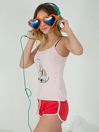 KiloTeens presents: This doll really knows how to have fun with her and how she can show off her pussy and listen to some beats at the same time.